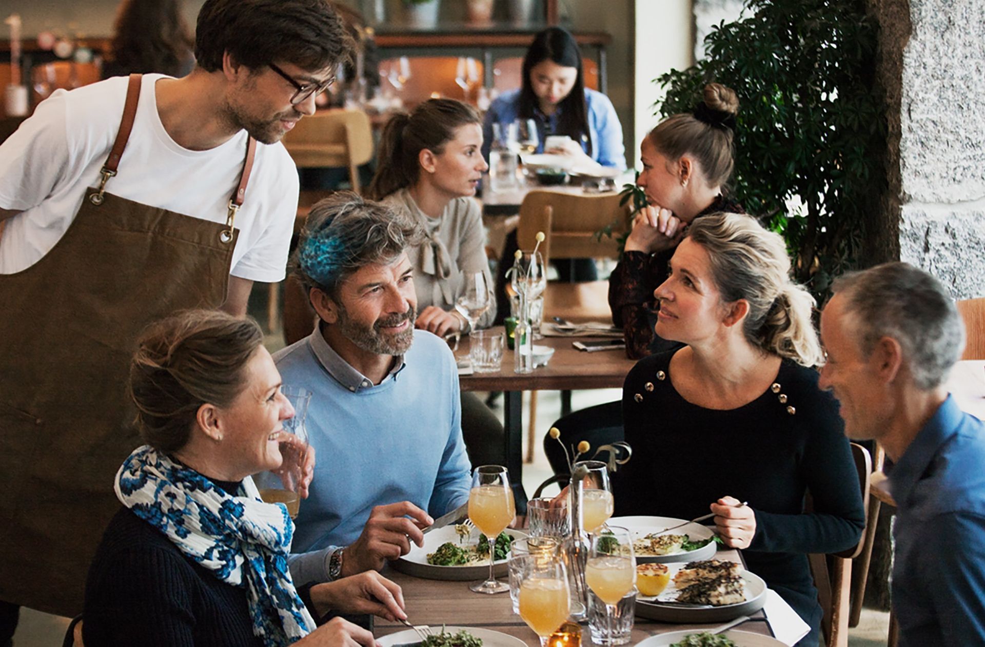 A group of people with Oticon's clinical trials with Opn Hearing Aids