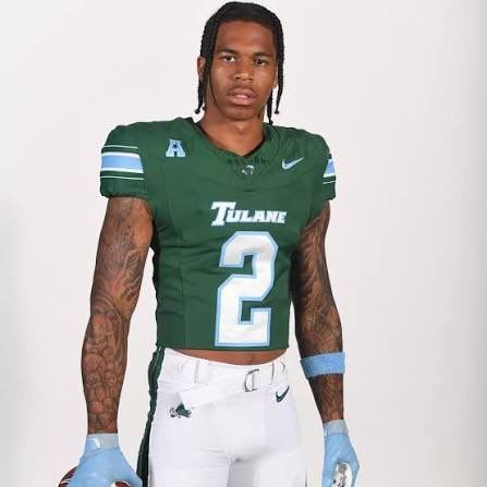 Tulane football player in green jersey number 2, standing against a plain background.