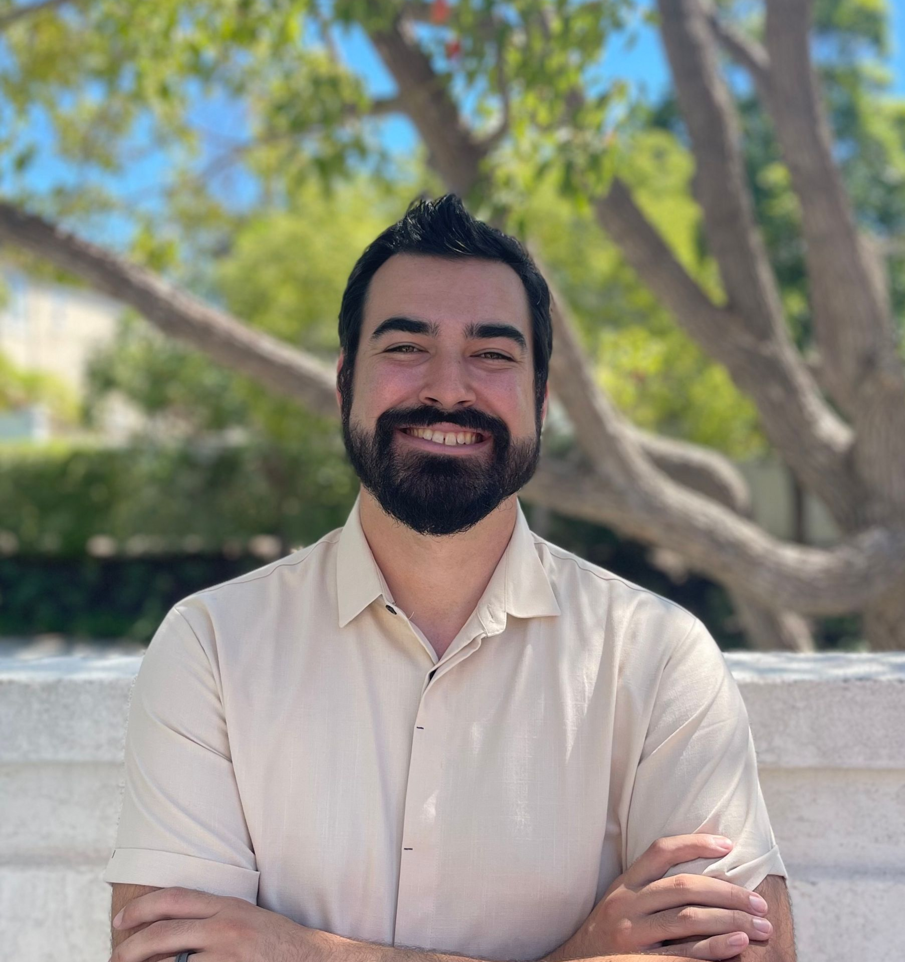 A man with a beard wearing a black hoodie with the word geek on it