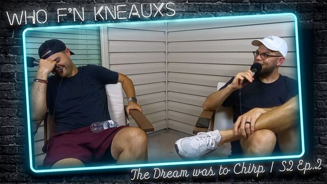 Two men are sitting in front of a neon sign that says who f n kneauxs