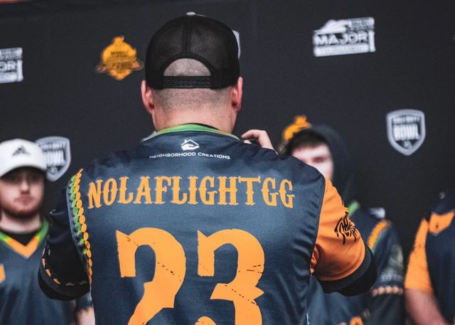A man wearing a jersey with the number 23 on it