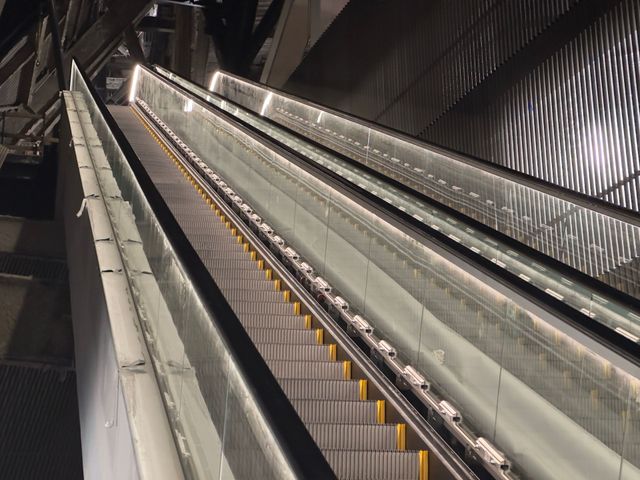 A close up of an escalator in a subway station