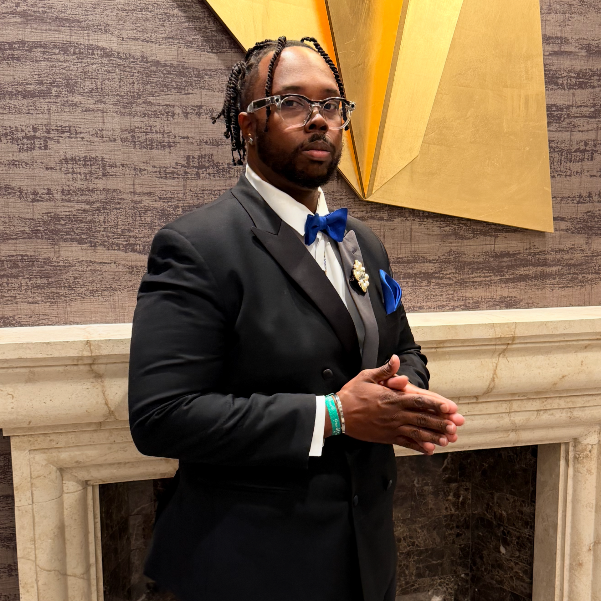 A man with a beard wearing a black hoodie with the word geek on it