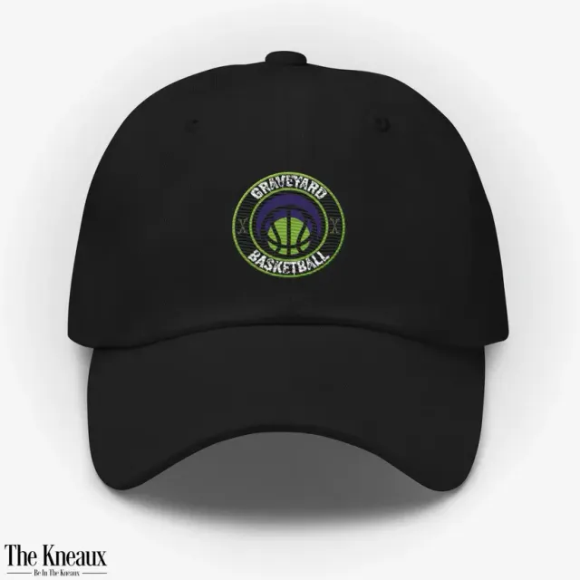 A black baseball cap that says graveyard basketball on it