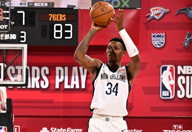 A basketball player with the number 34 on his jersey