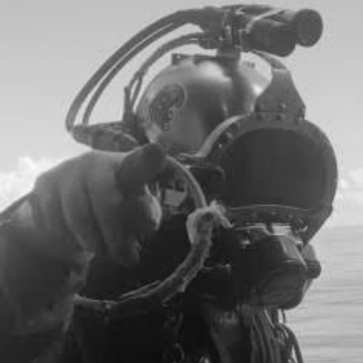 A man with a beard wearing a black hoodie with the word geek on it