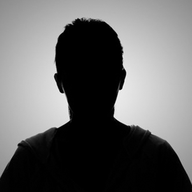 It is a silhouette of a man 's head without a face.