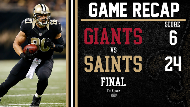 A football player is running with the ball next to a scoreboard that says game recap