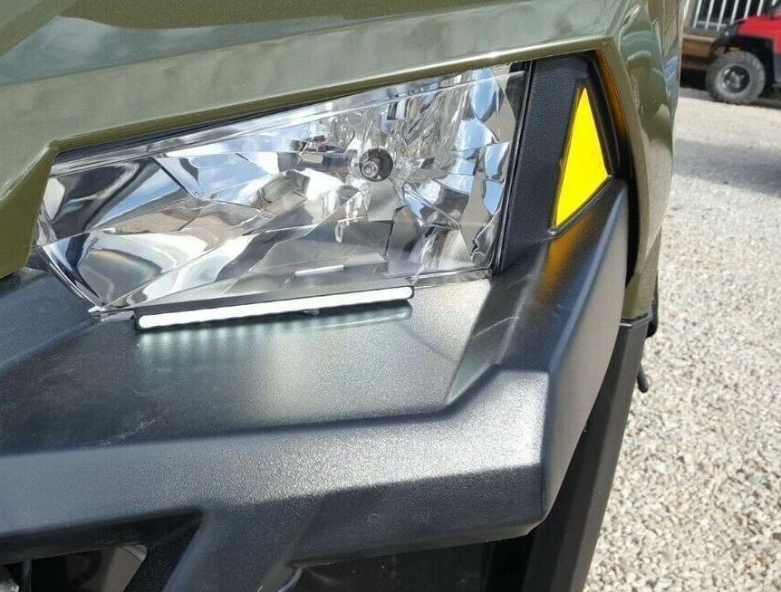 A close up of a headlight on a vehicle