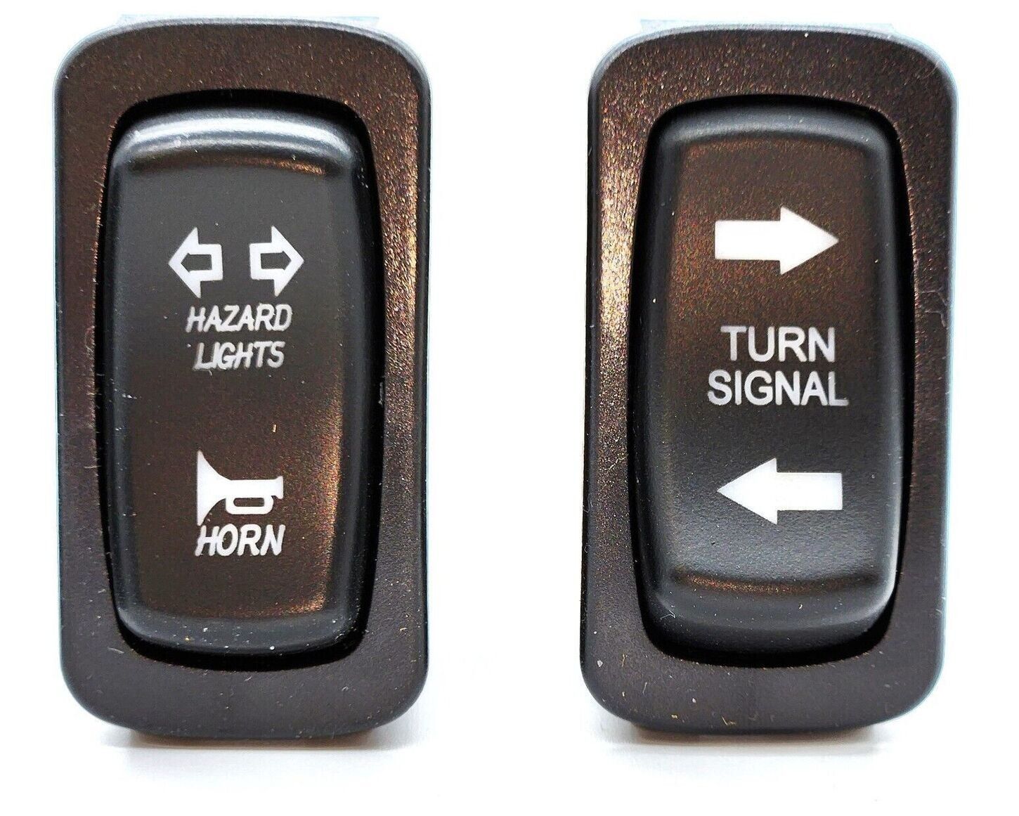 A pair of hazard lights and turn signal switches