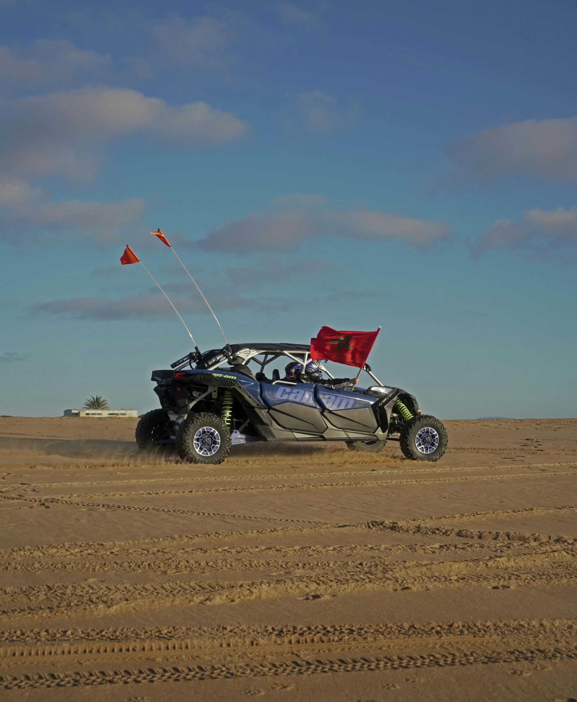 A person is riding a utv in the desert.