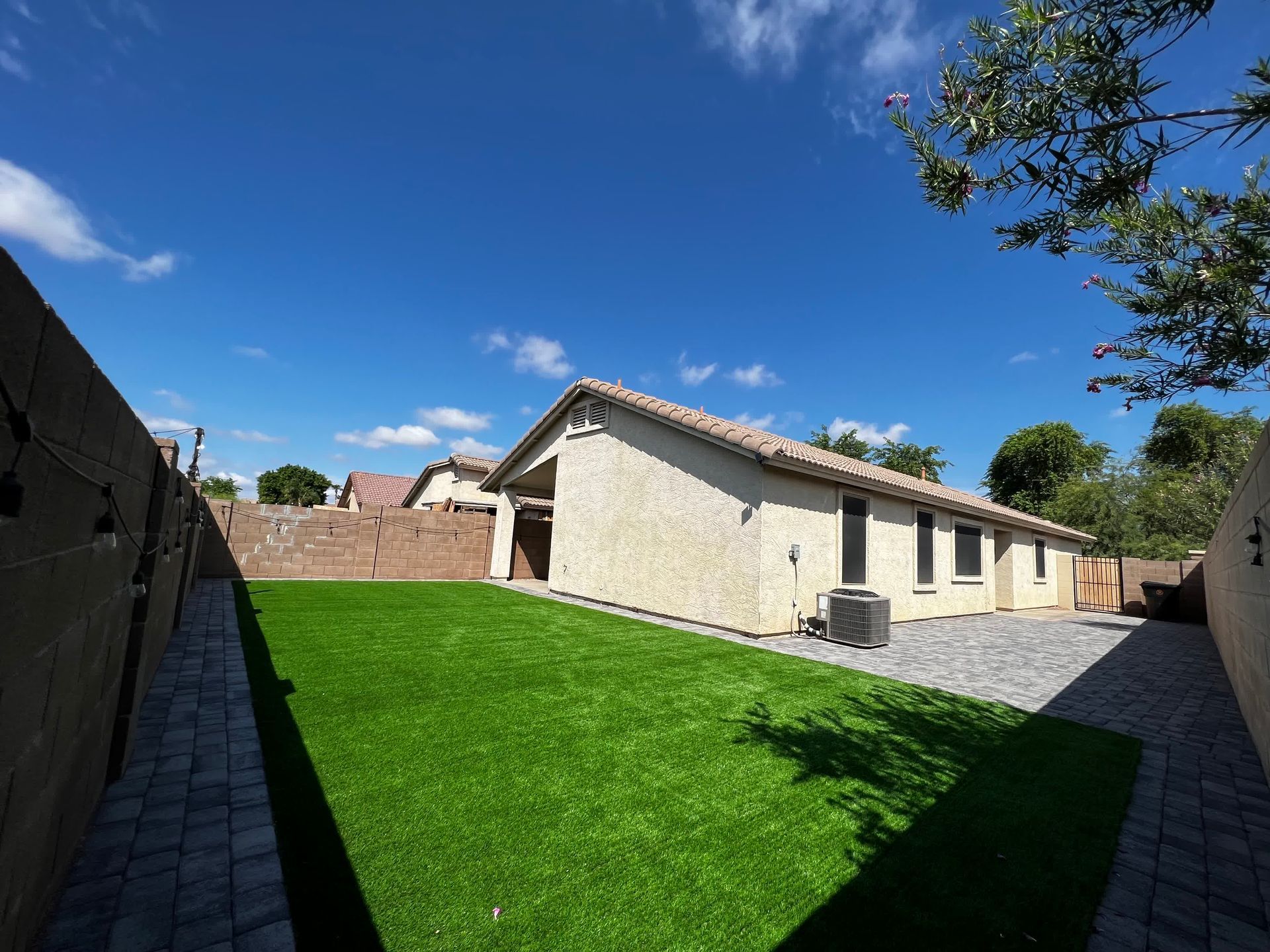 A house with a large lawn in front of it