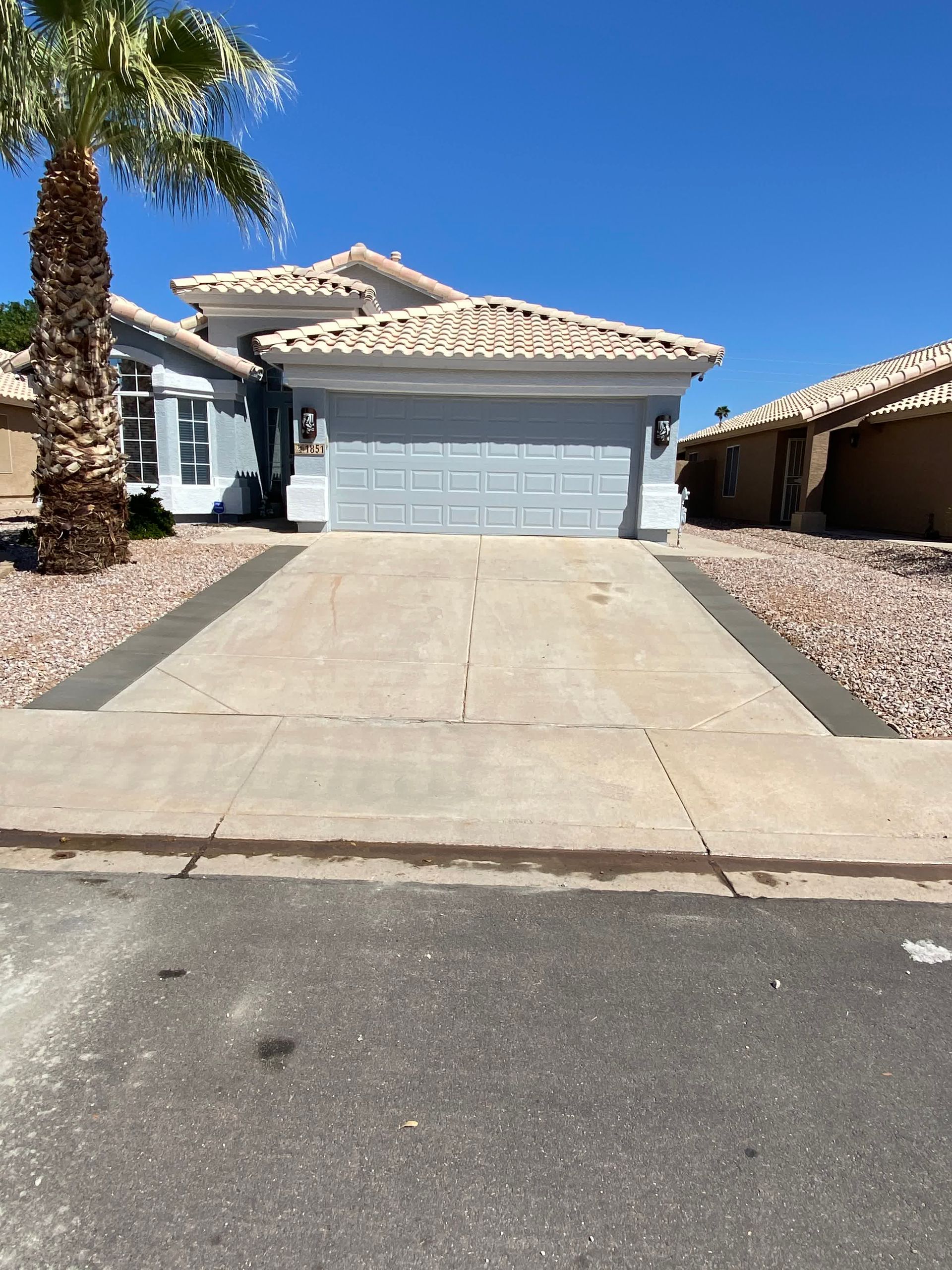 A house with a palm tree in front of it