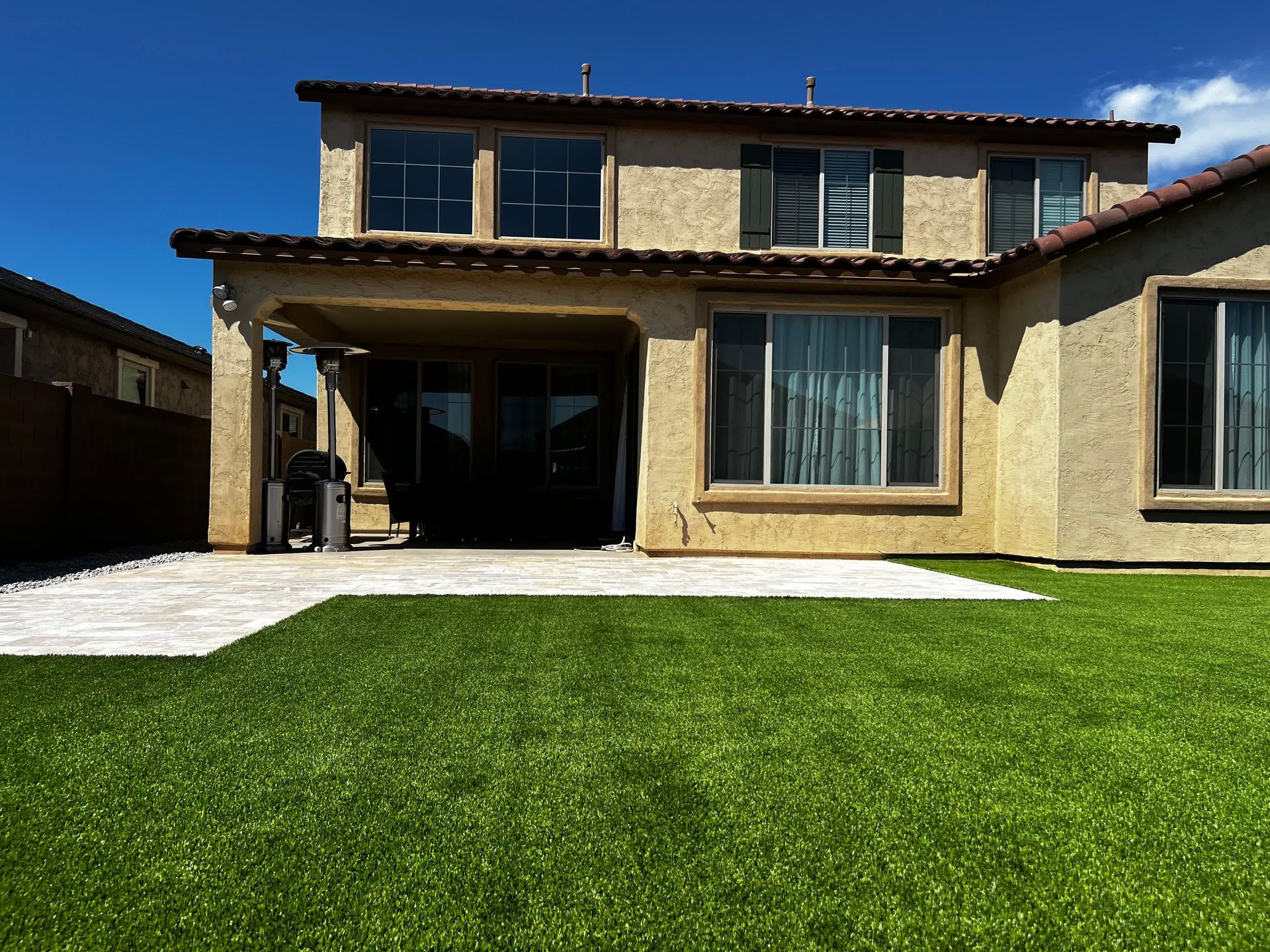 A large house with a lush green lawn in front of it