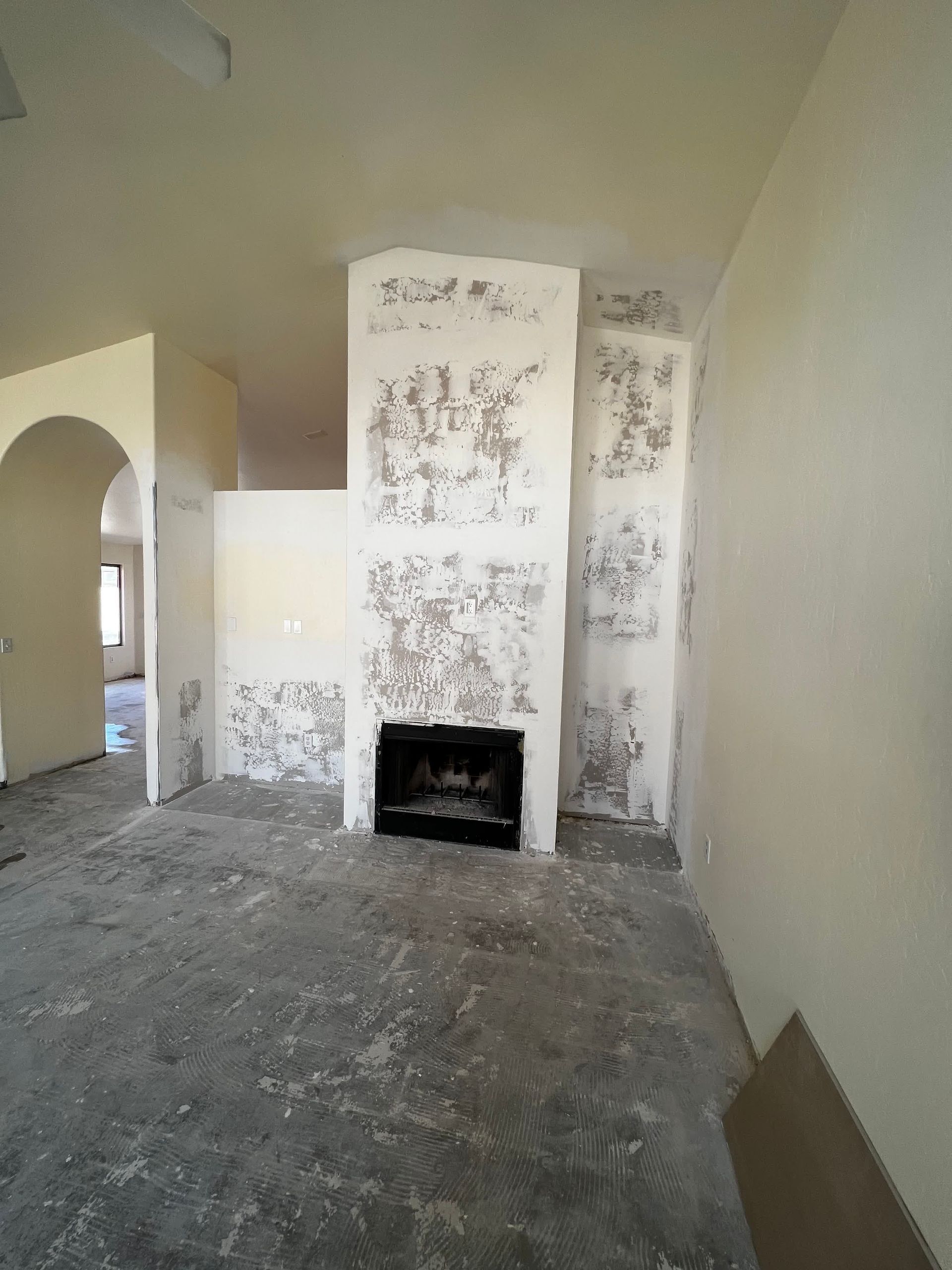 There is a fireplace in the middle of the room.