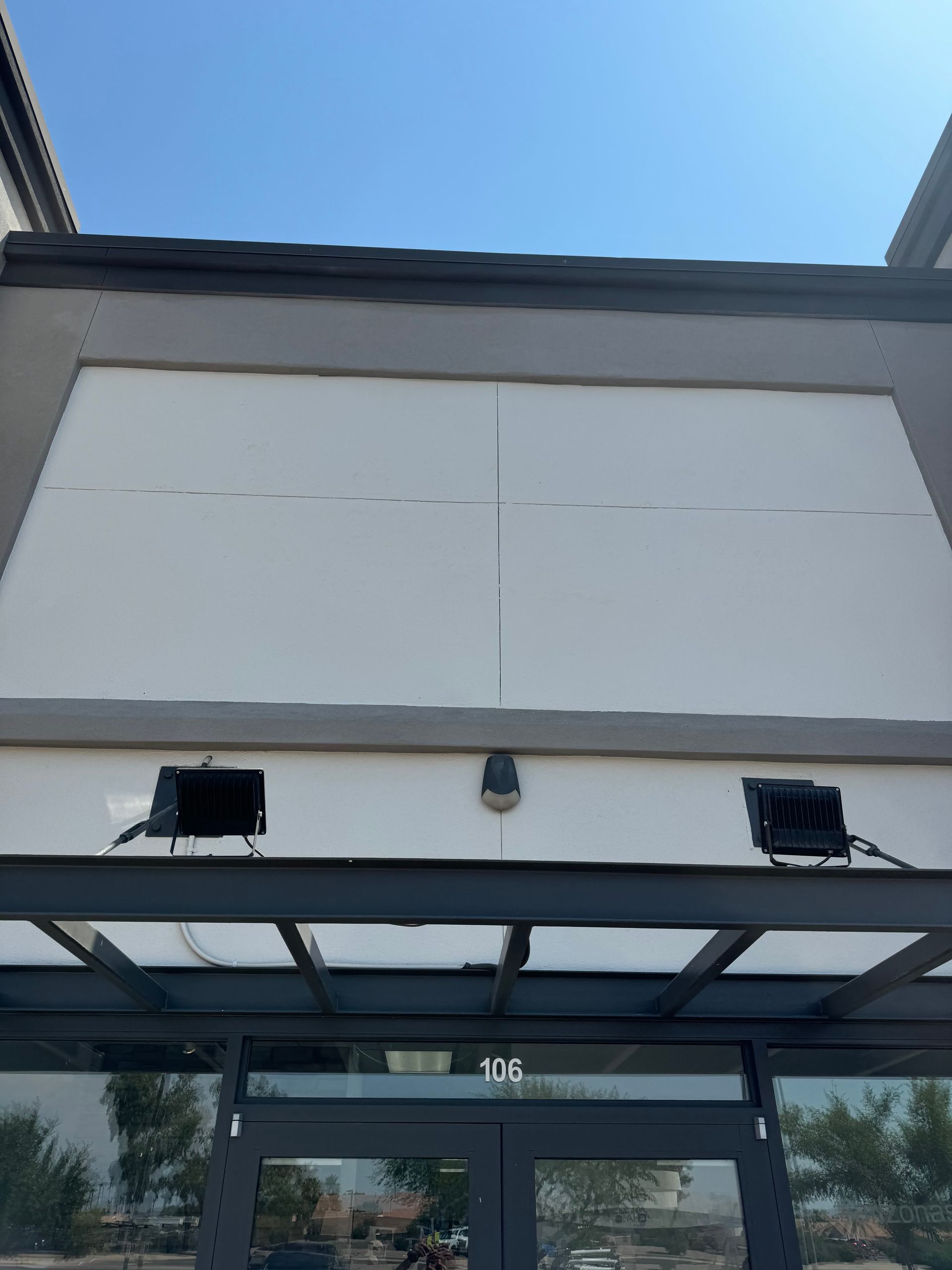 The front of a building with the number 106 on it