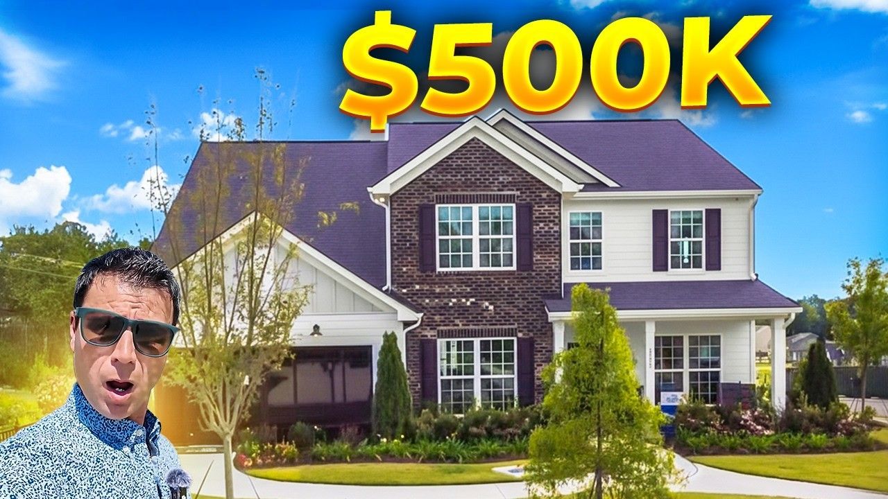 Man in sunglasses in front of a $500K house.