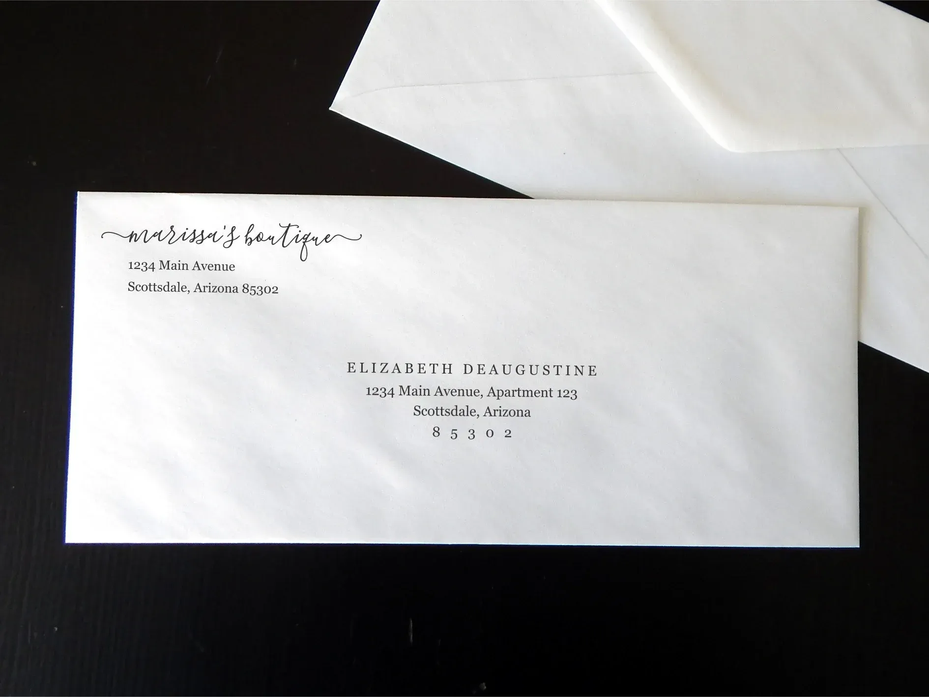 Custom printed business envelopes designed to match professional letterhead.