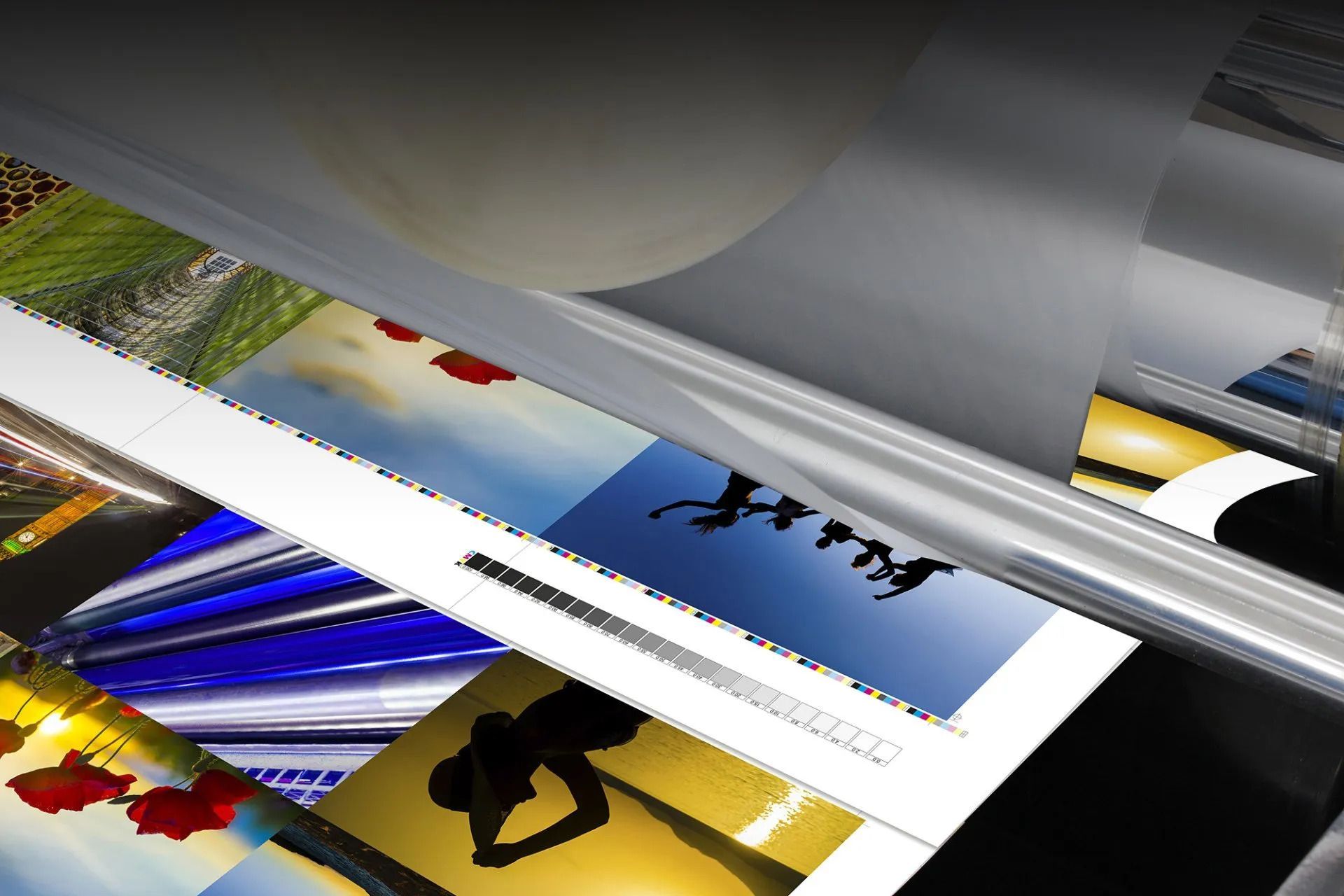 Large format printing machine creating colorful banner graphics at Valley Press of Las Vegas