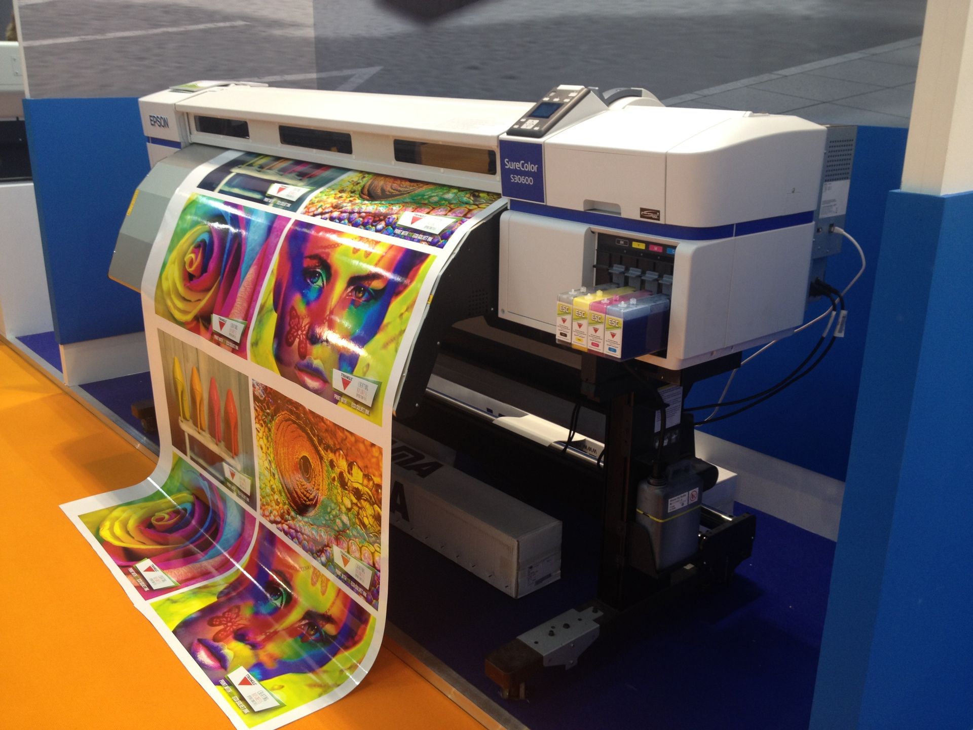 Close-up of large format printer producing high-resolution posters with vivid colors in Las Vegas print shop