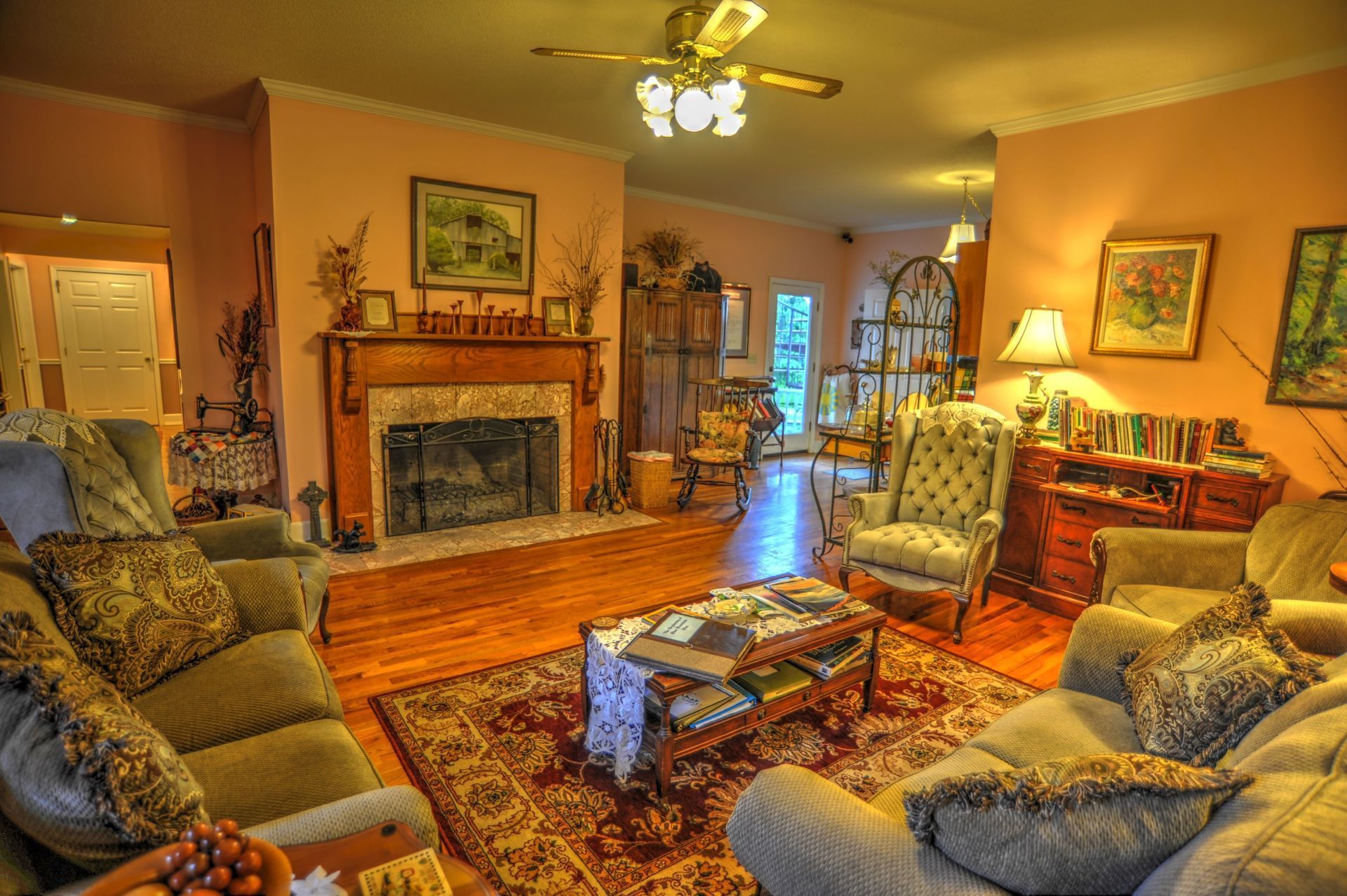 A living room filled with furniture and a fireplace.