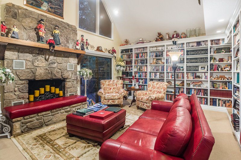 A living room filled with furniture and a fireplace.