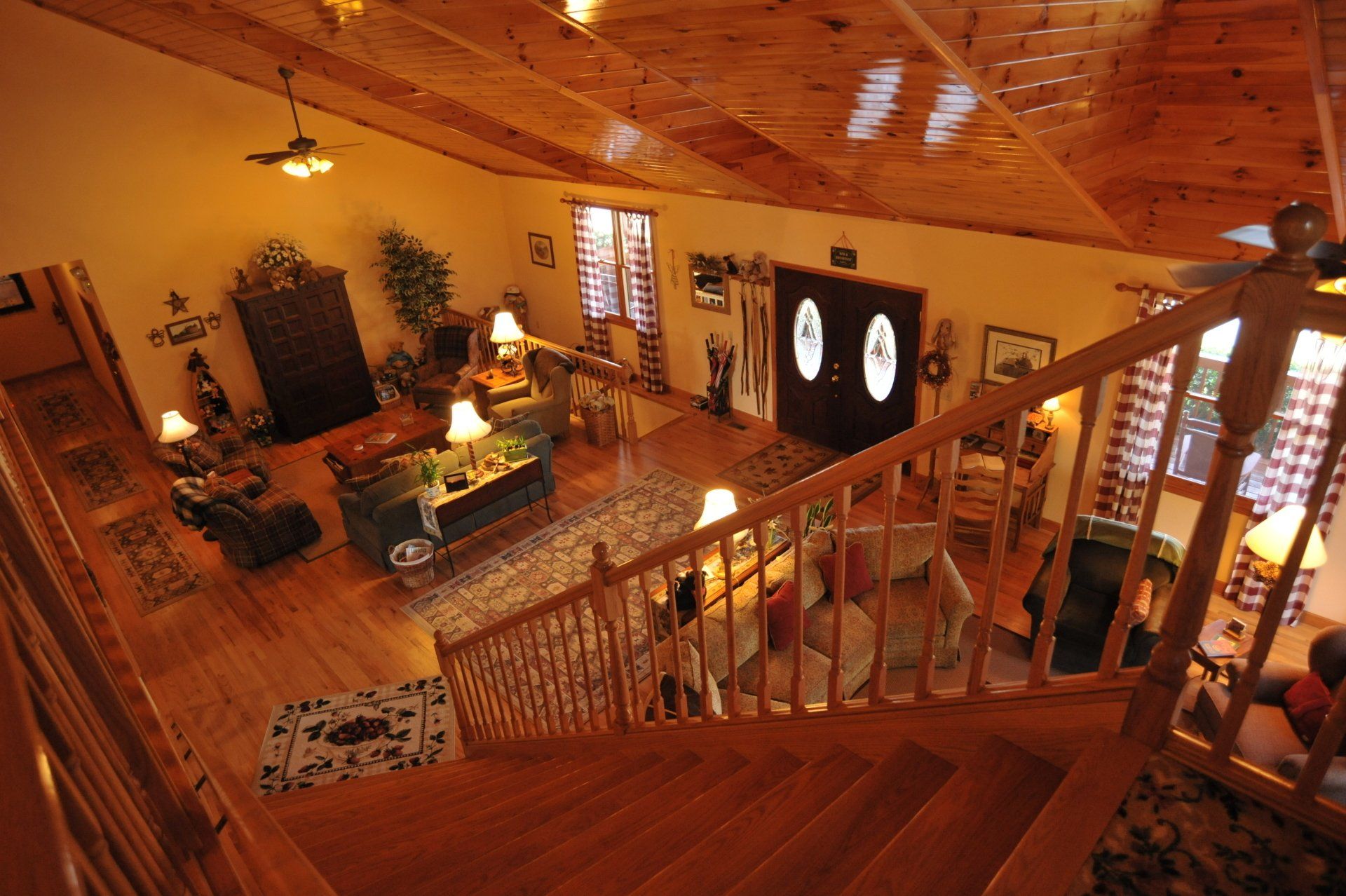 An aerial view of a living room from the stairs