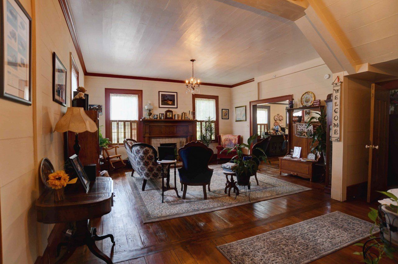 A living room filled with furniture and a fireplace.