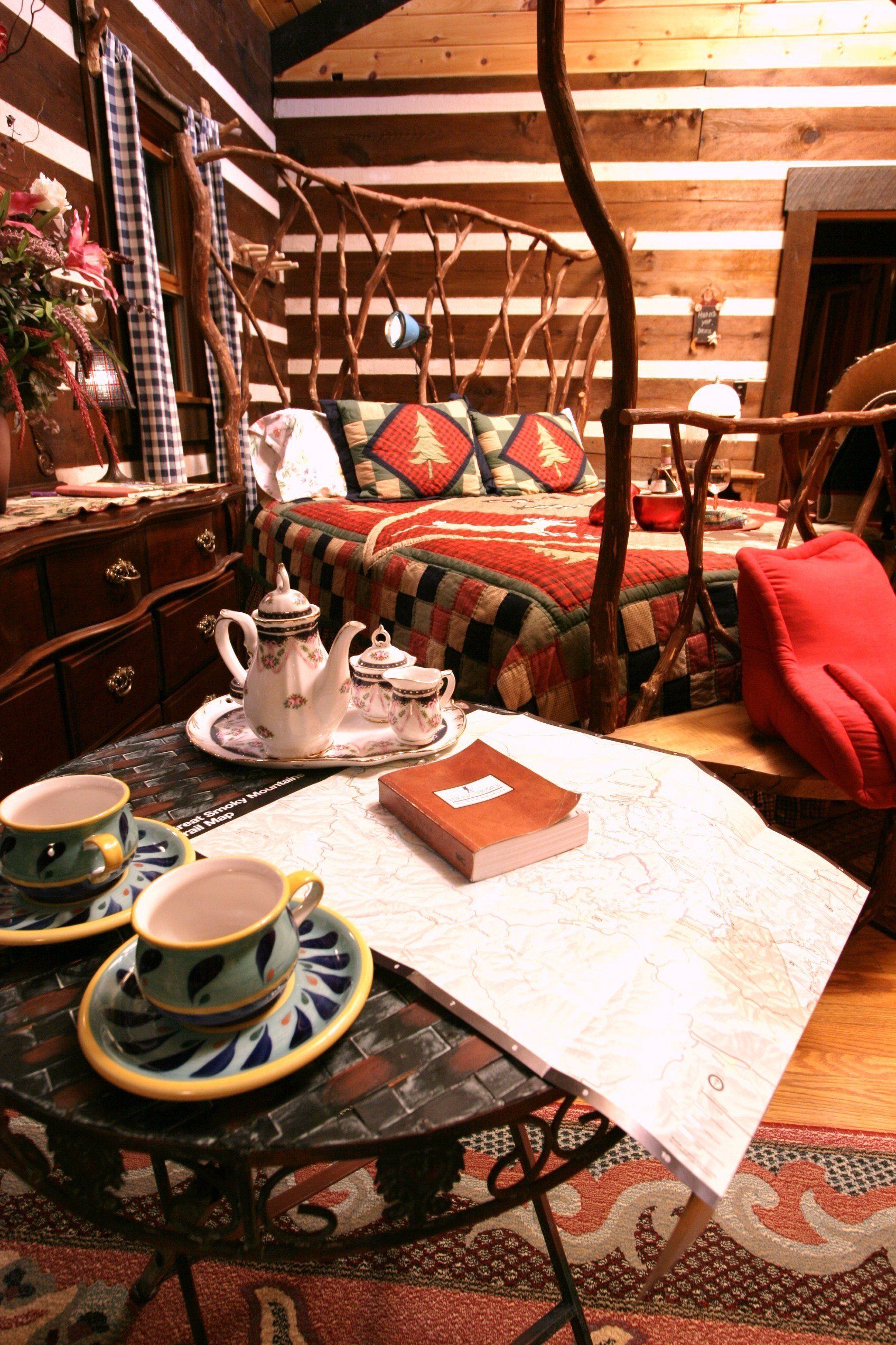 A table with two cups and saucers and a book on it