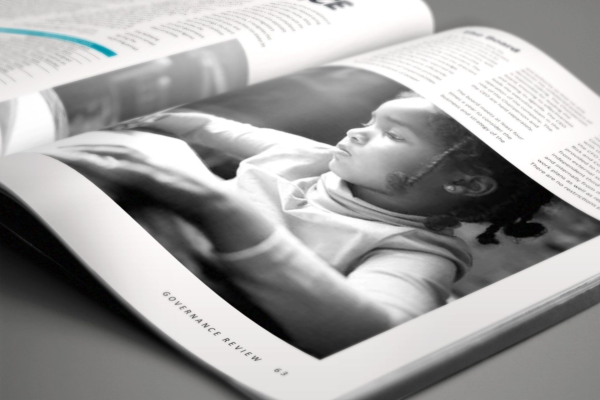 A black and white photo of a baby in a magazine