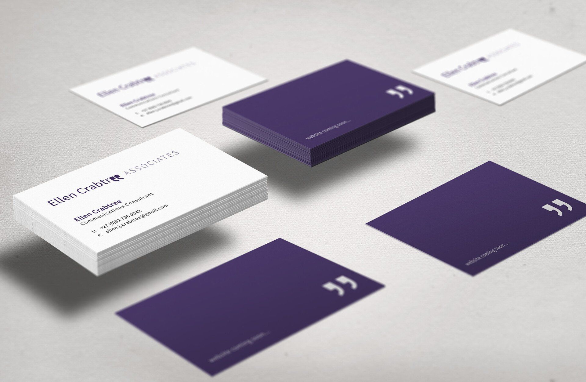 Purple and white business cards are floating in the air