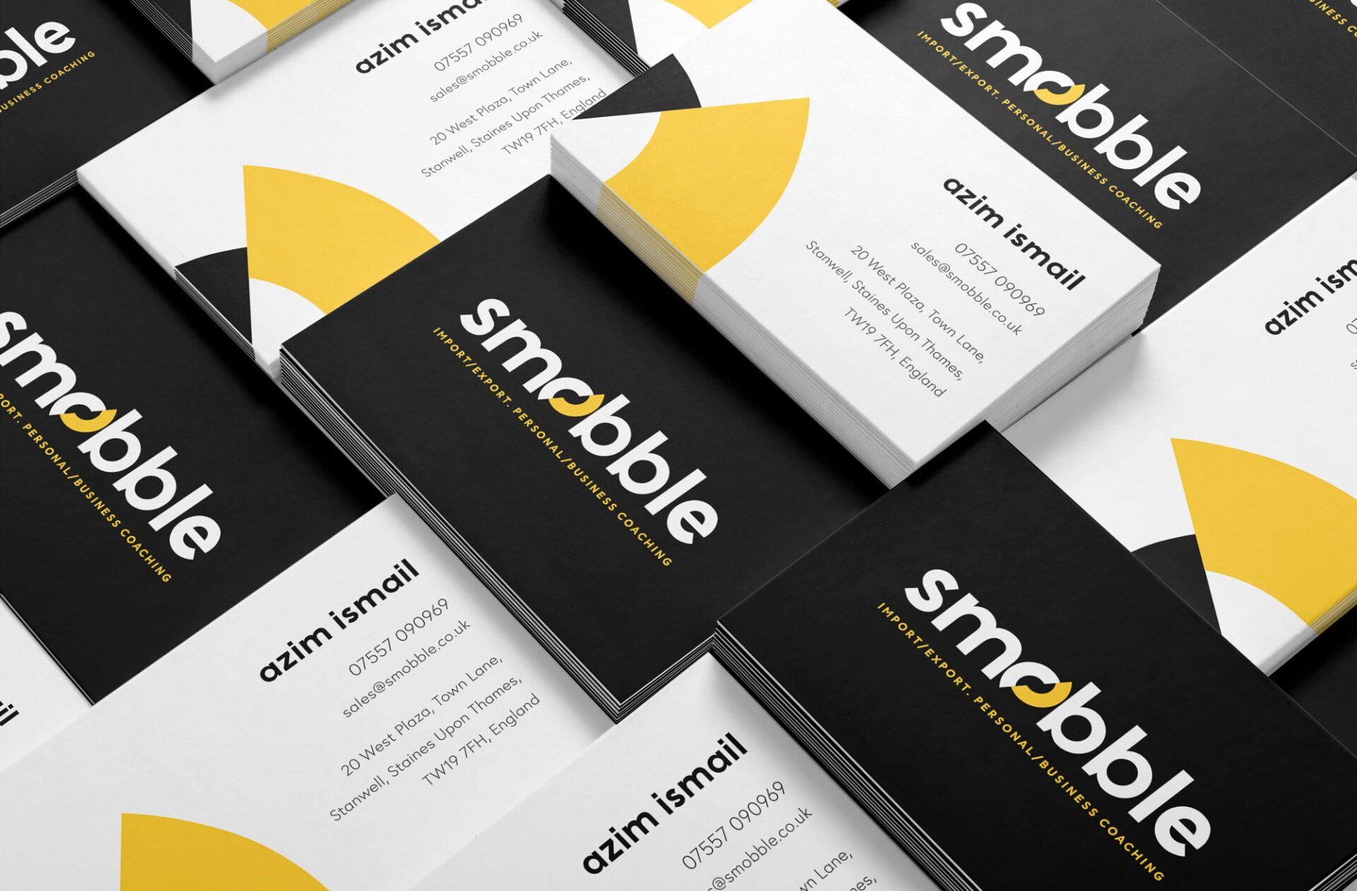 A bunch of business cards are stacked on top of each other.