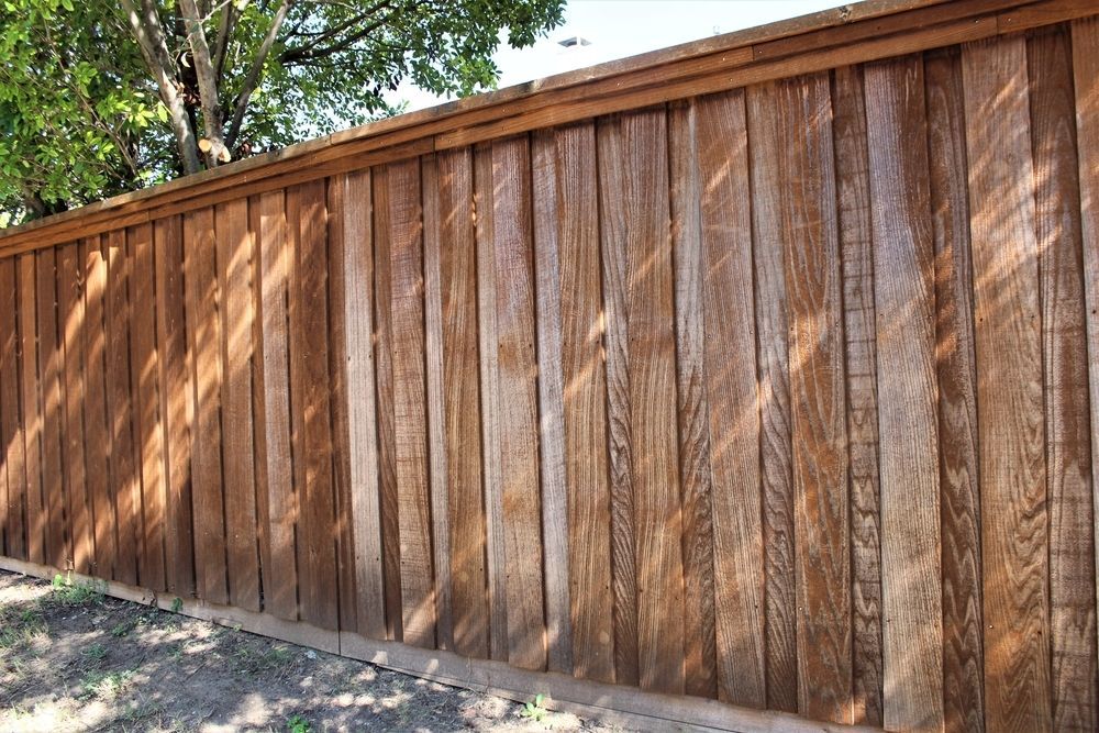 Brown Wooden Privacy Fence With Diagonal and Vertical Slats — KLS Fencing In Normanton, QLD