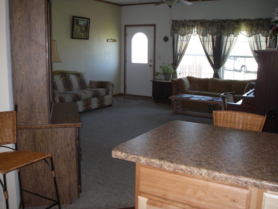 A living room with a couch and a door