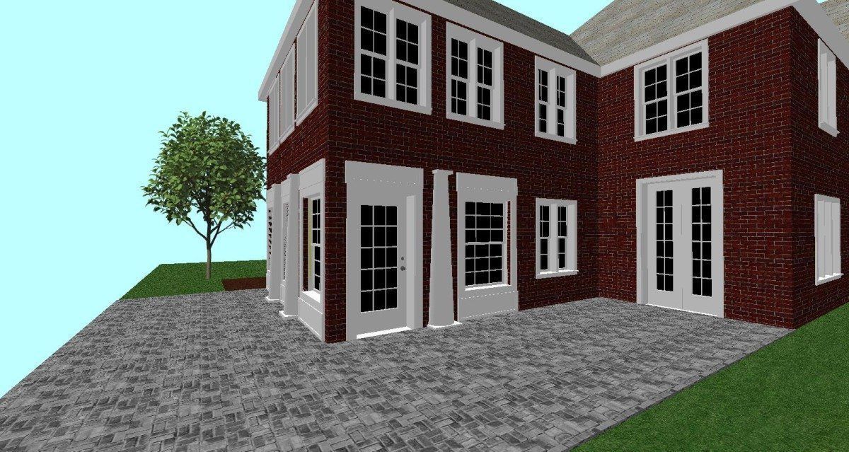 A brick house with a tree in front of it