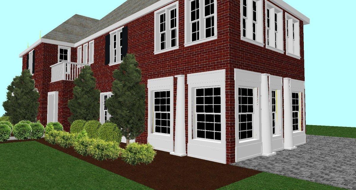 A large red brick house with white trim and windows