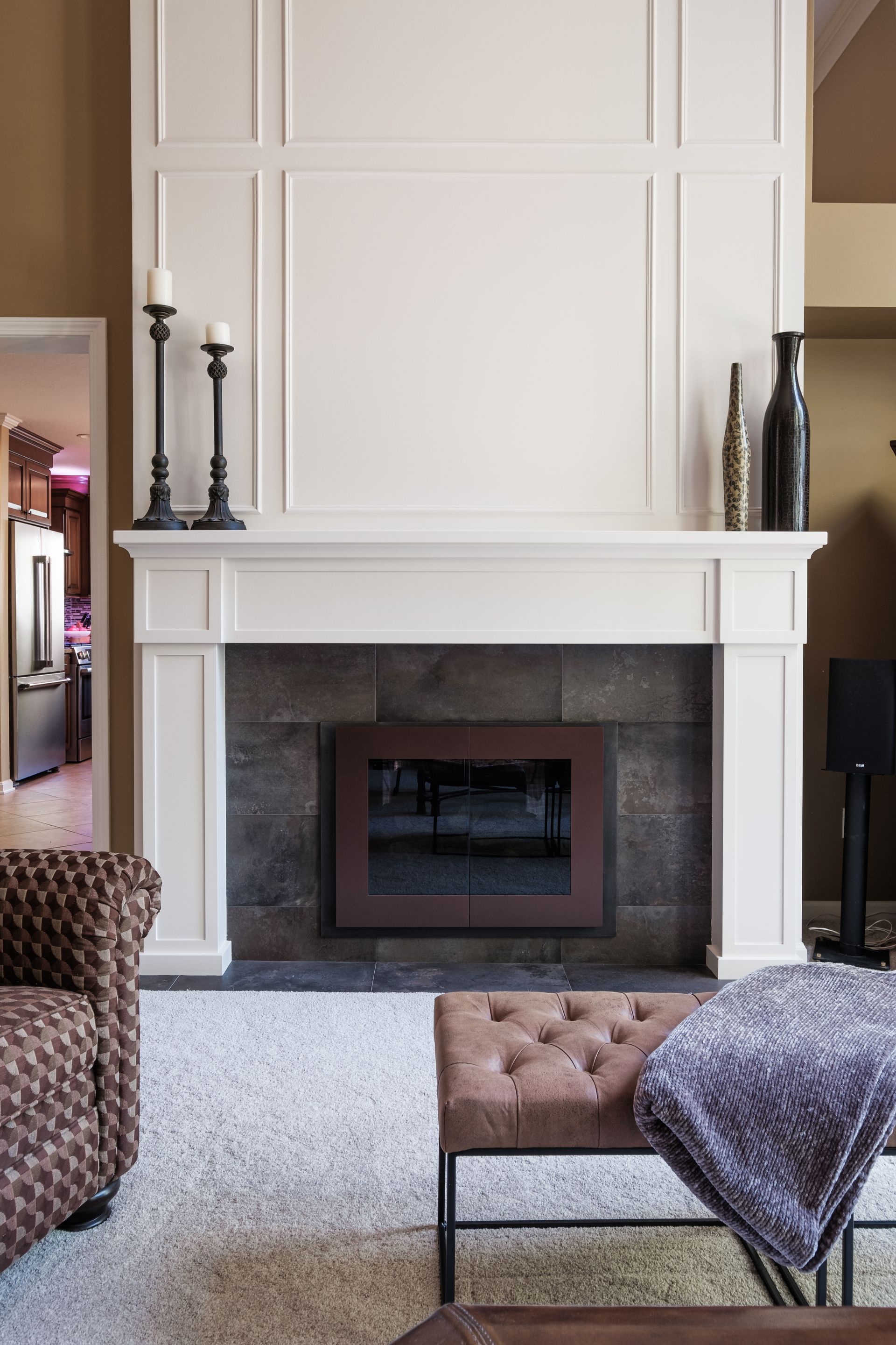 A living room with a fireplace and a couch