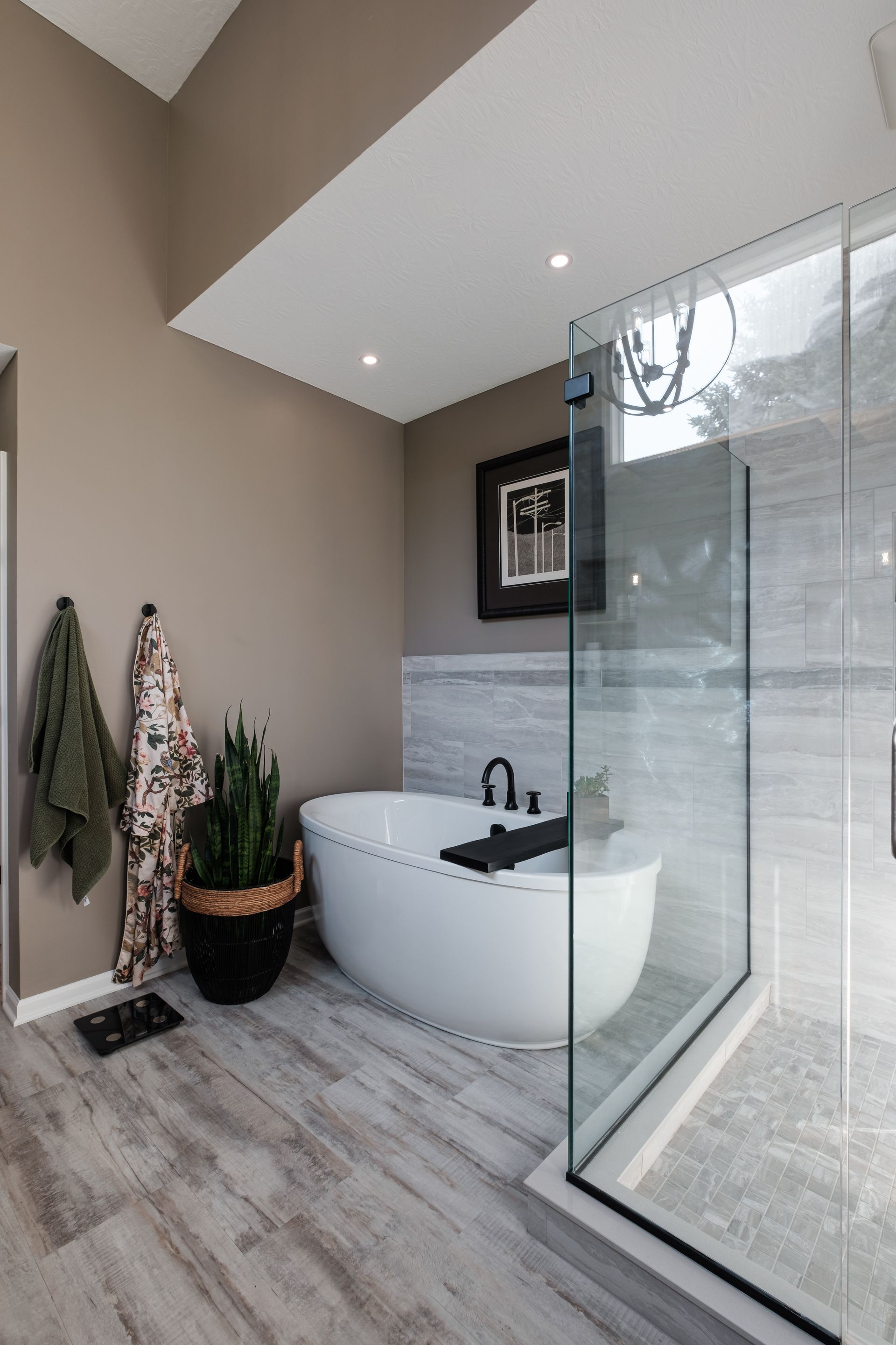 A bathroom with a bathtub and a walk in shower.