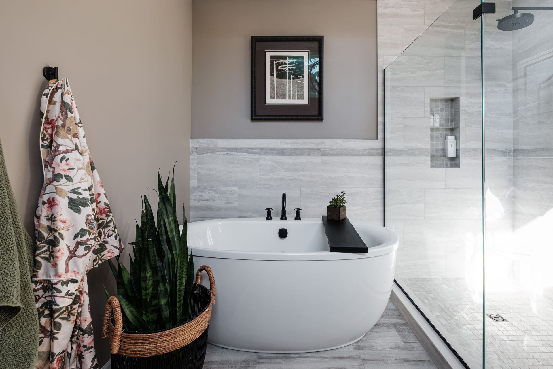 A bathroom with a bathtub and a shower.
