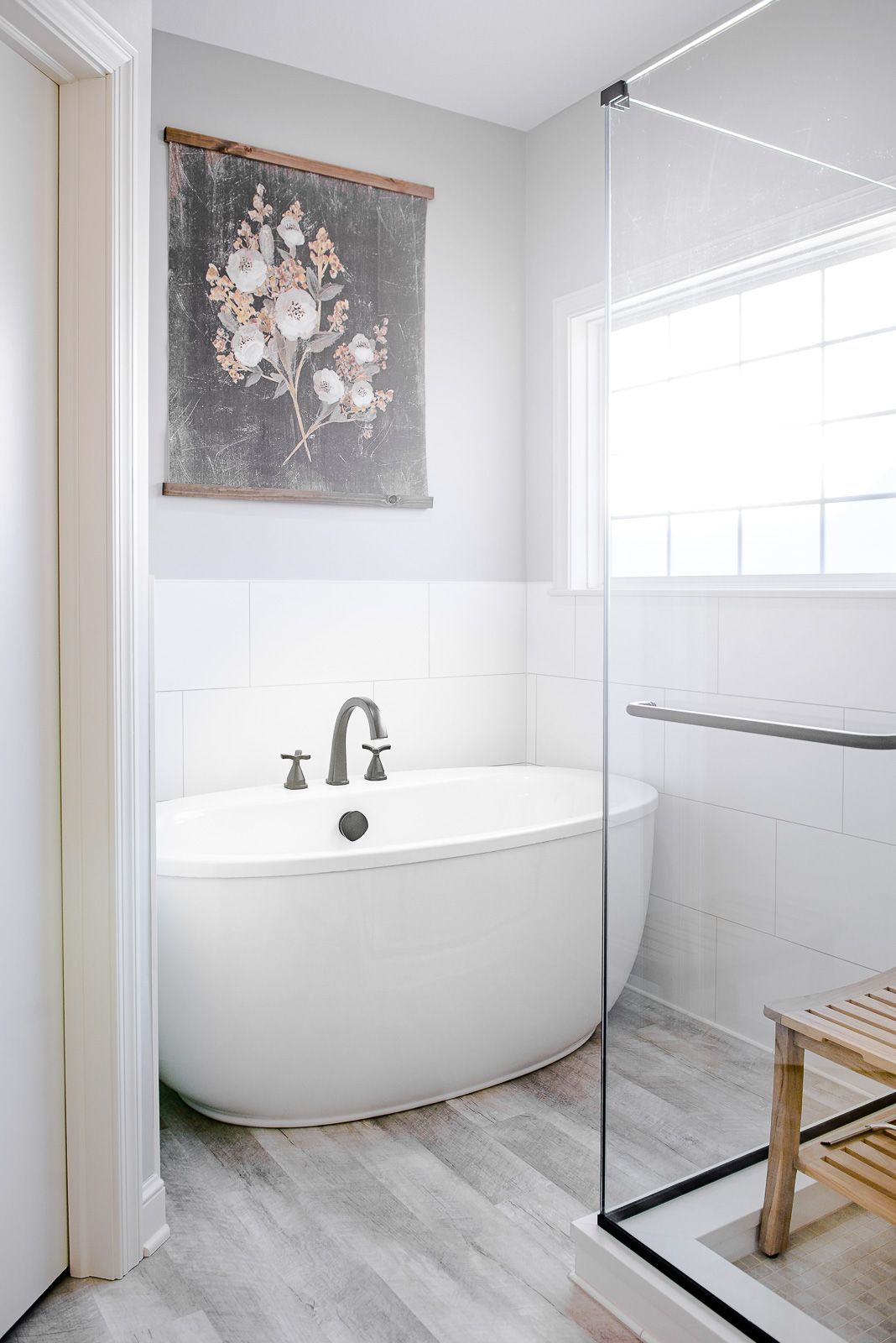 A bathroom with a bathtub and a walk in shower.