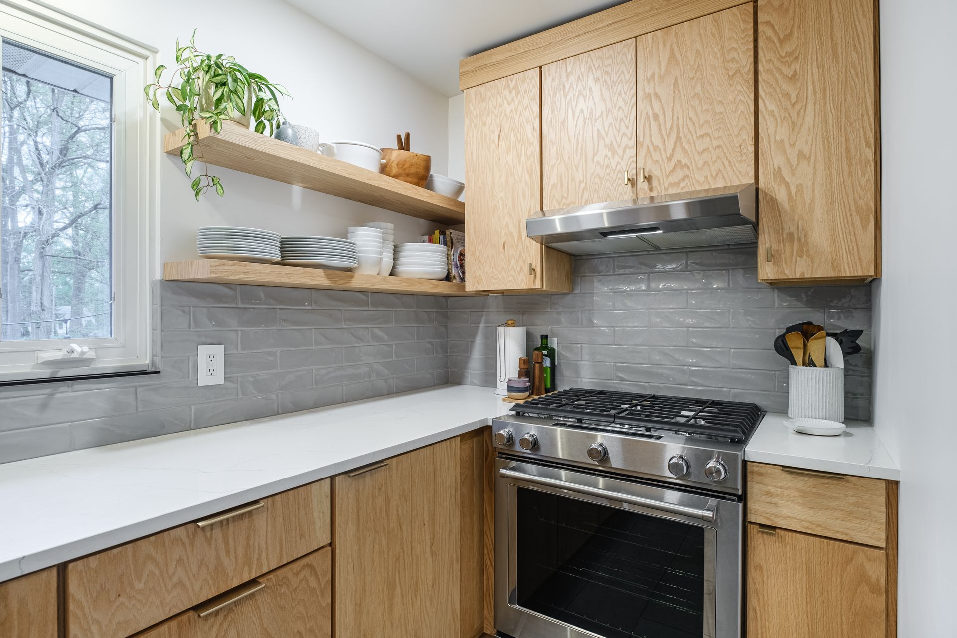 A kitchen with wooden cabinets and stainless steel appliances.