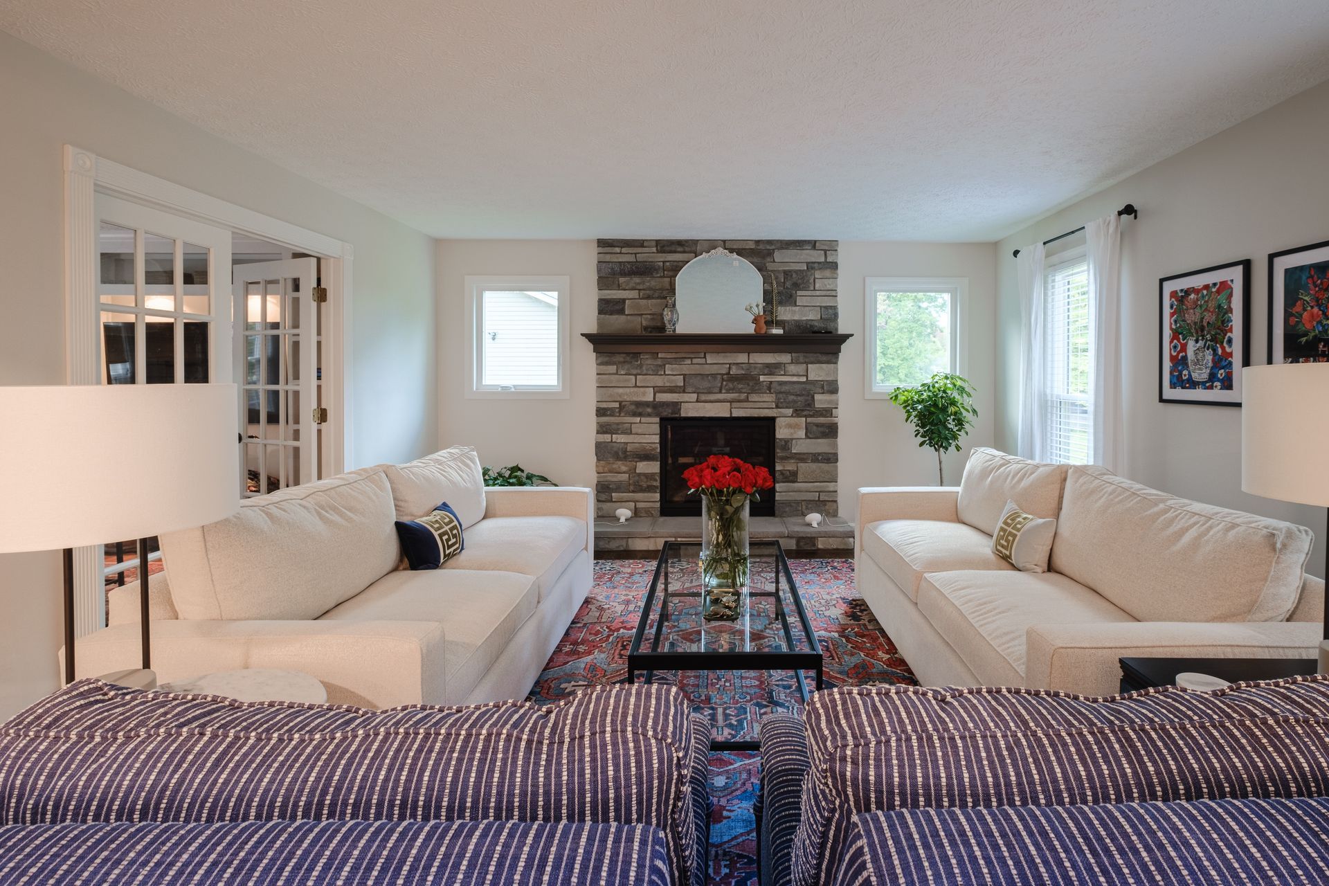 A living room with two couches and a fireplace