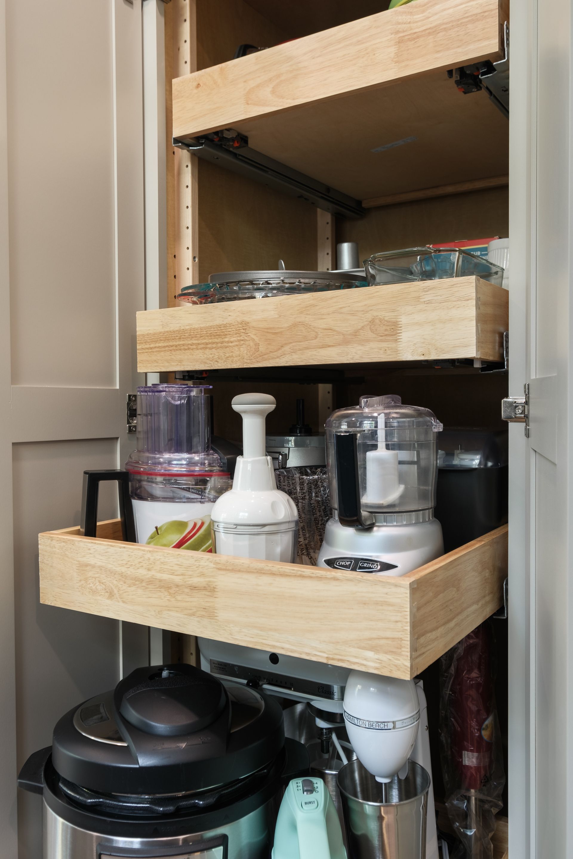 A kitchen pantry with a bunch of appliances in it