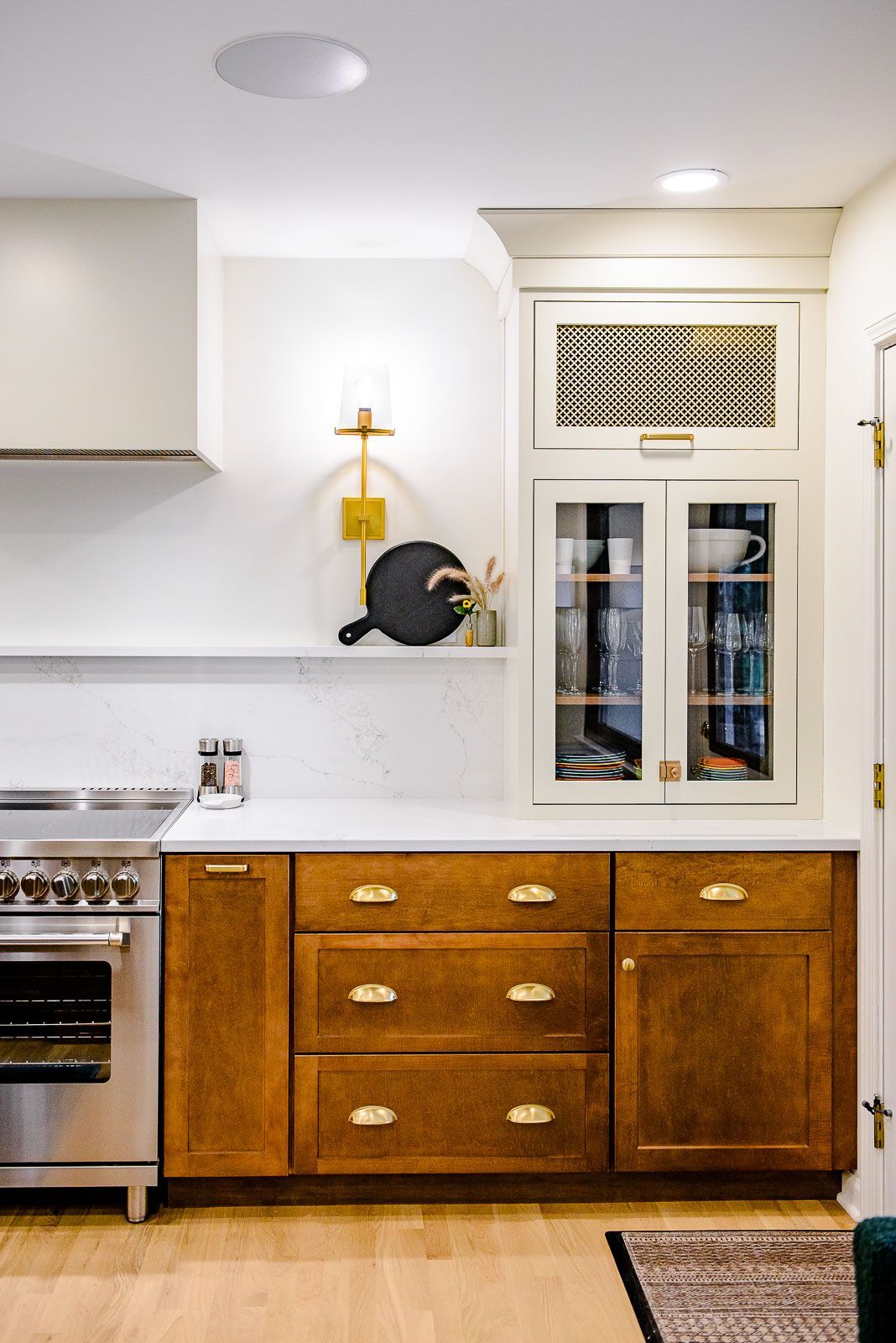 A kitchen with wooden cabinets and stainless steel appliances