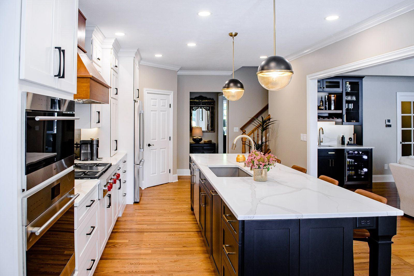 There is a large island in the middle of the kitchen.
