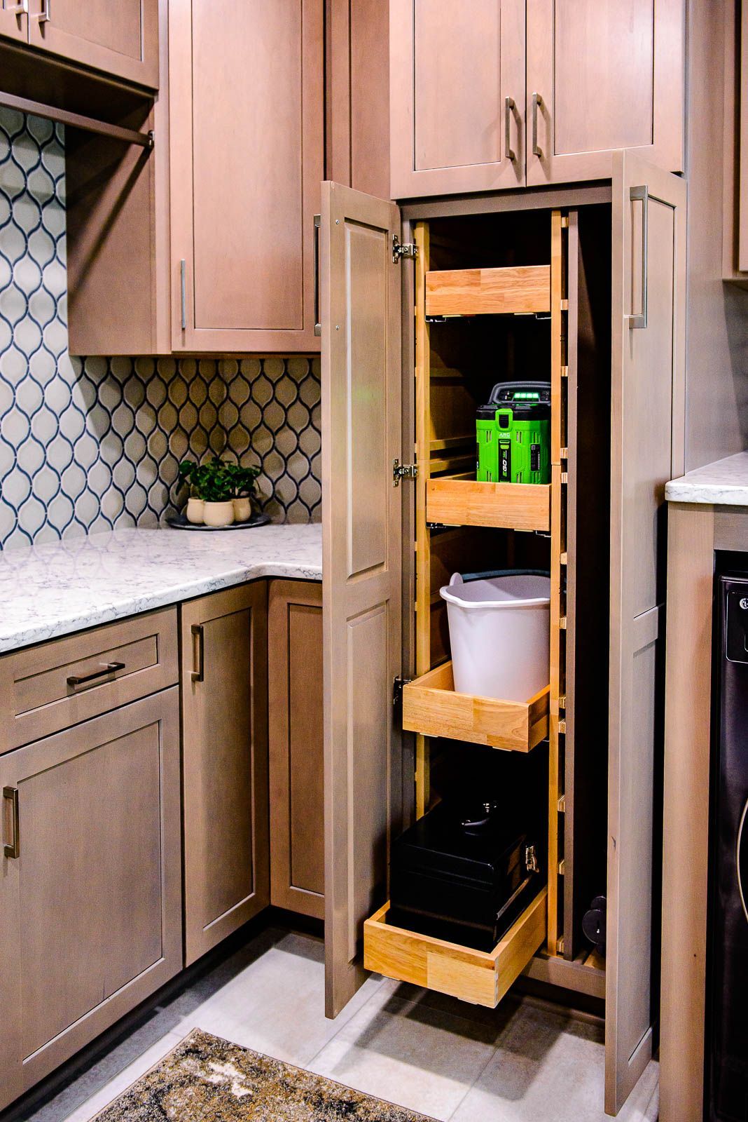 A kitchen with wooden cabinets and a pull out shelf.