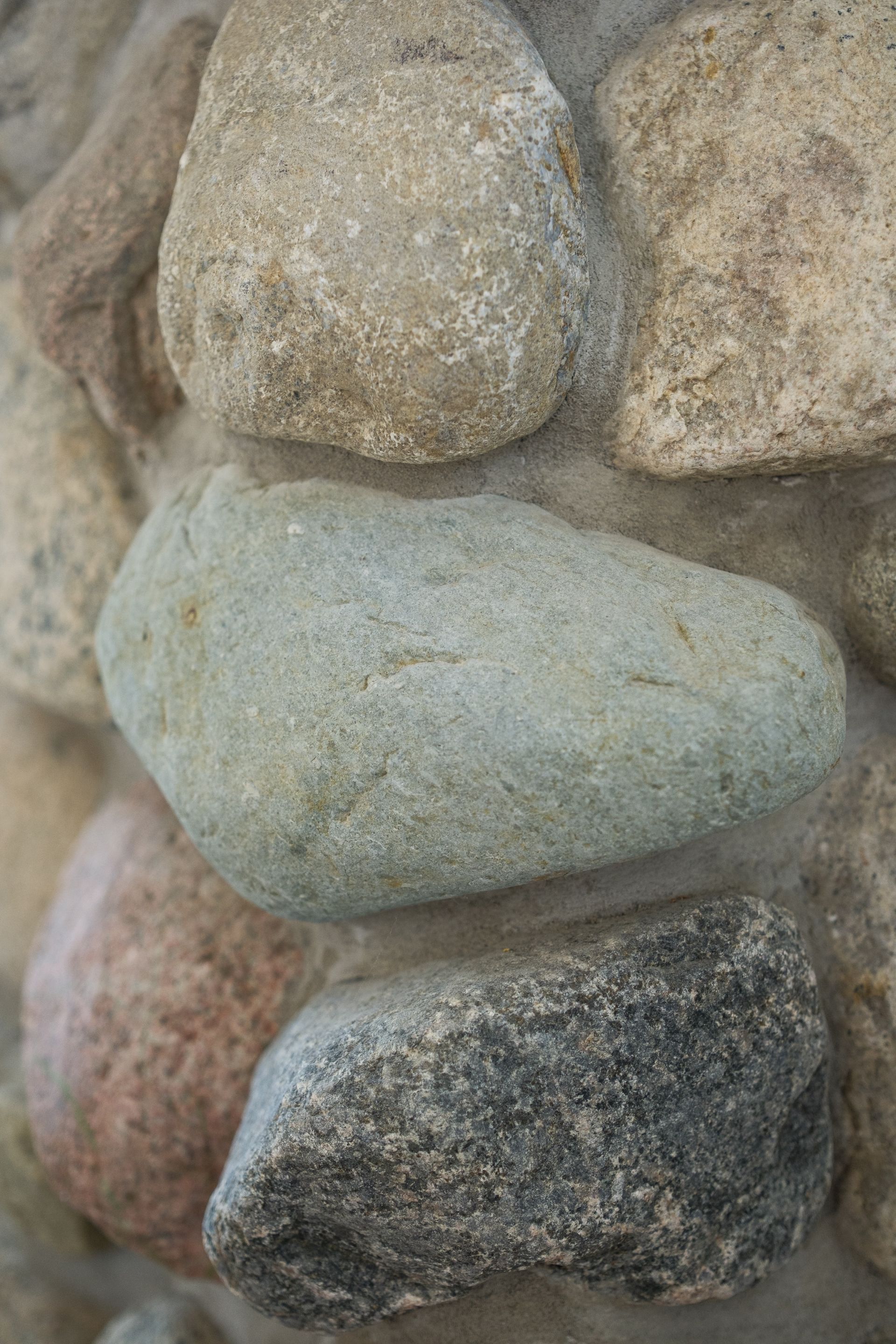 A close up of a pile of rocks on a wall.