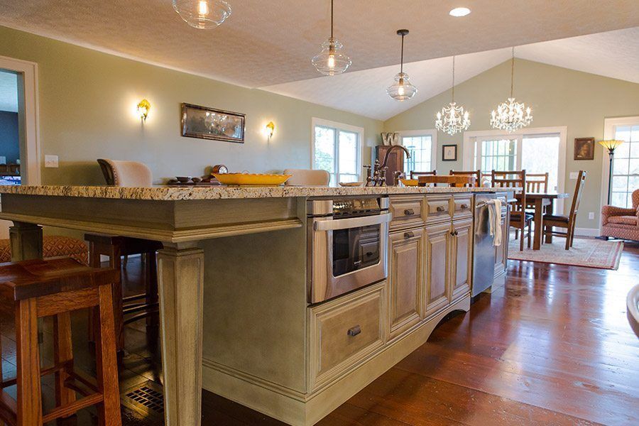A kitchen with a large island in the middle of the room.