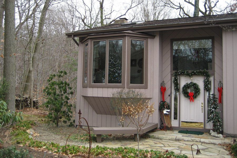 A house with a christmas wreath on the door