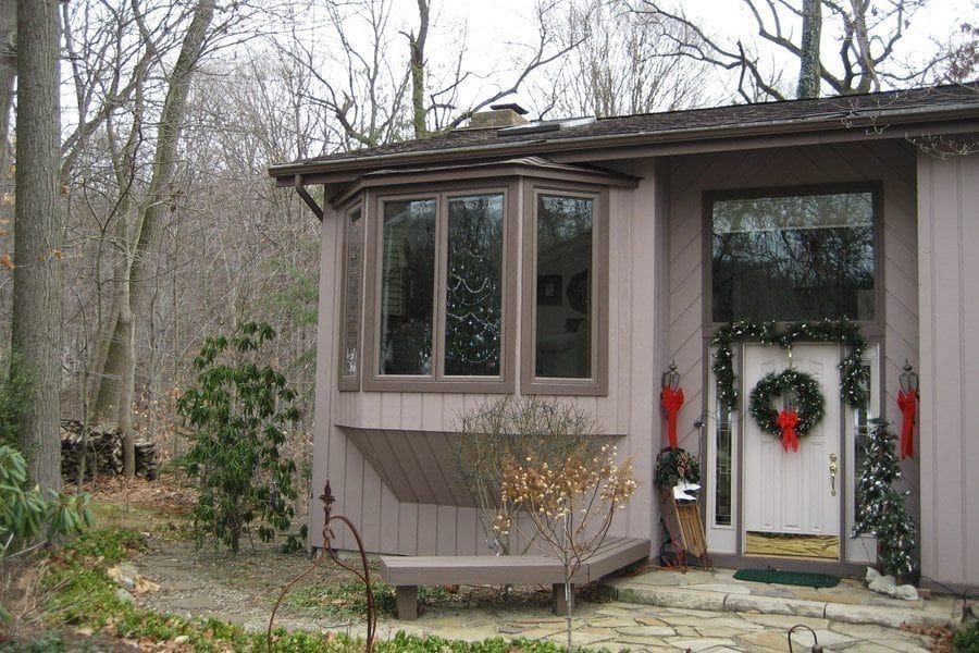 A house with a christmas wreath on the door